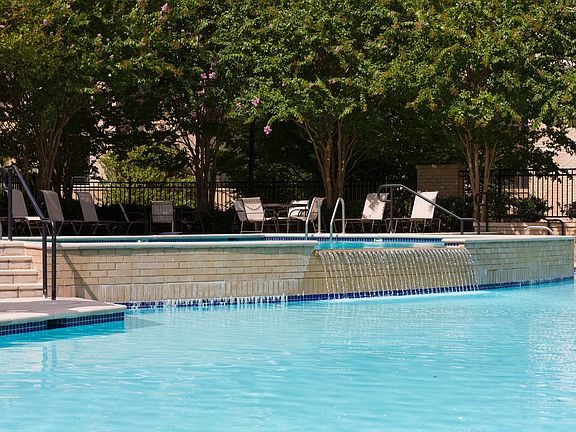Olympic-Sized Pool with Swimming Lanes, Free Swim Area, and Expansive Sundeck with Chaise Lounge Chairs