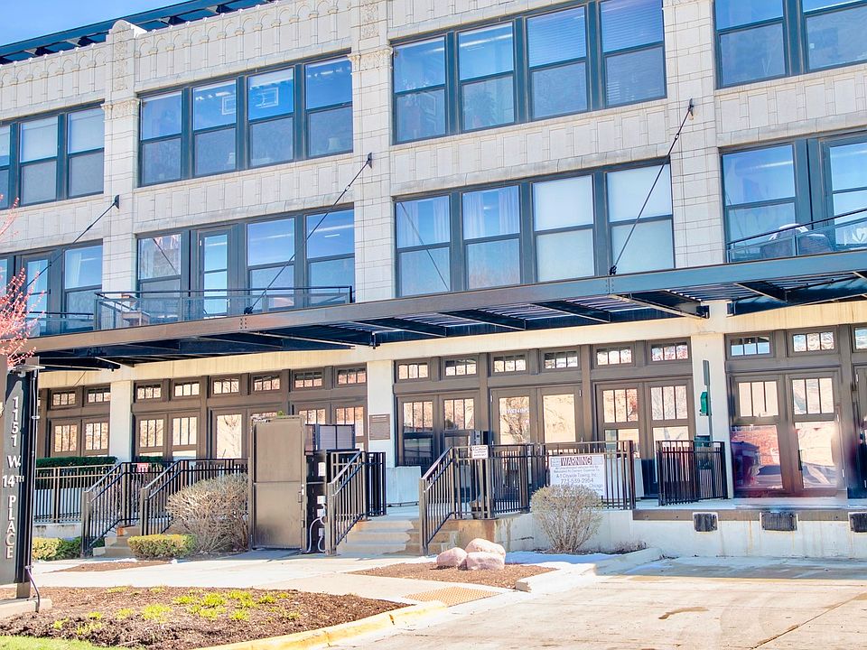 View of West lobby entrance w/ wheelchair lift and partial loading dock