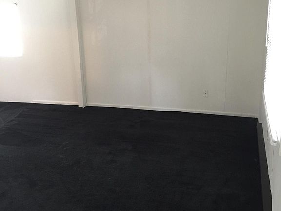 looking from front door to other side of living room