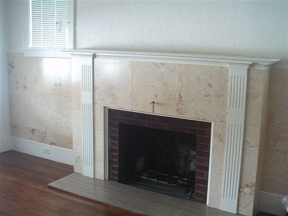 Fireplace in living room with hardwood floor