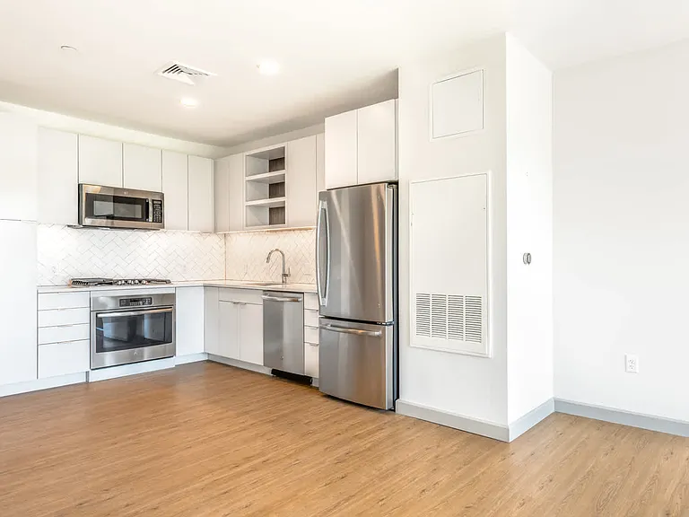 The Flats - Kitchen with Stainless Steel Appliances and Granite Countertops
