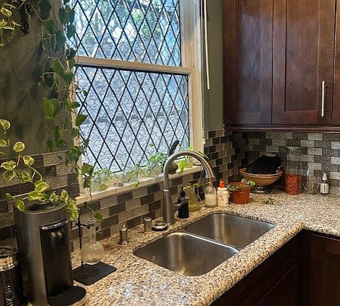 Give me those dirty dishes! To be able to look out onto nature from your kitchen sink is a true pleasure. Note Granite countertops throughout.