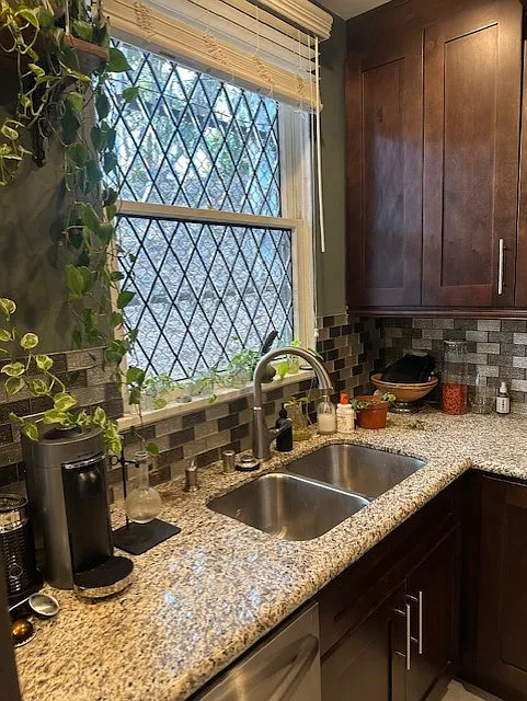 Give me those dirty dishes! To be able to look out onto nature from your kitchen sink is a true pleasure. Note Granite countertops throughout.