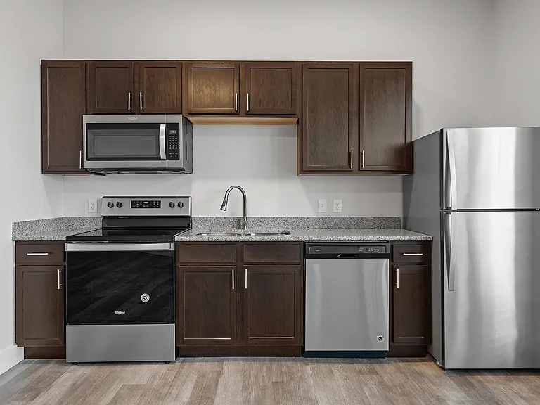 Dark Wood Cabinetry + Stainless Steel Appliances Dark Wood Cabinetry + Stainless Steel Appliances