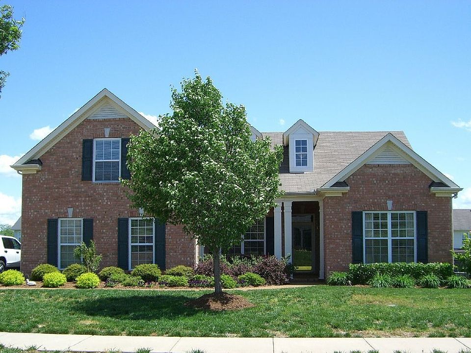 Brick ranch*landscaping*covered porch*storm door