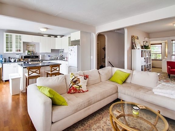 Decorated living room/kitchen/alcove