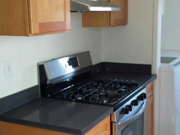 Stove, exh fan, tuscany shaker cabinets