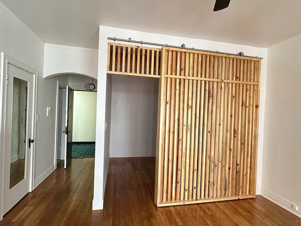 Sliding door with slats for either light or privacy.