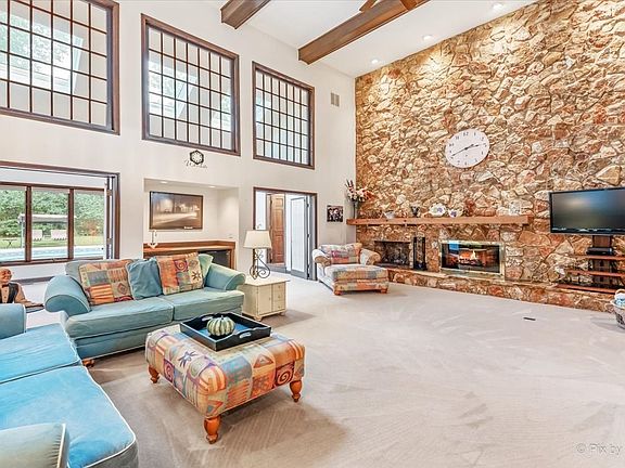Family Room with a wood burning fire place.