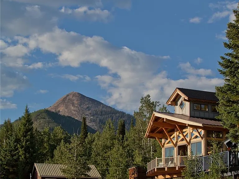 Hahns Peak guards the village