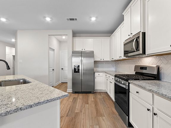 The sunny kitchen is equipped with state-of-the-art appliances!