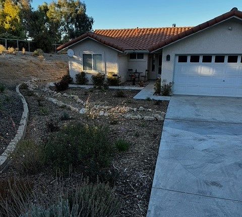 Front view with entry patio