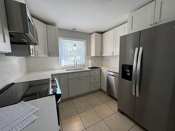 New kitchen, just remolded, New cabinets with granite counters. stainless steel appliances, Smooth top range and microwave new refrigerator and laundry on the main level washer and dryer included