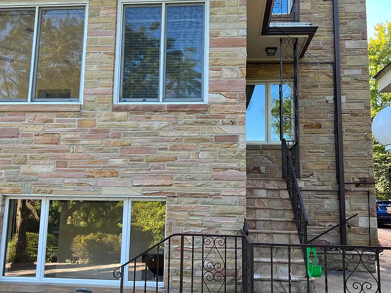 Side entrance off the family room leads to the driveway, garage' and rear yard