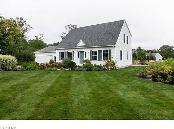 Surrounded by nature's growth and lush landscaping this house is picture perfect!