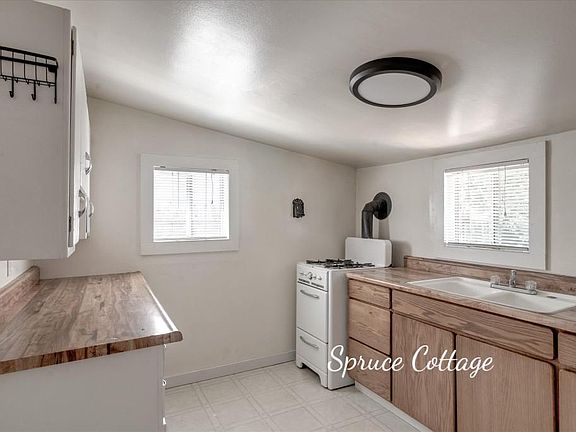 View of the kitchen. Gas range, double sink.