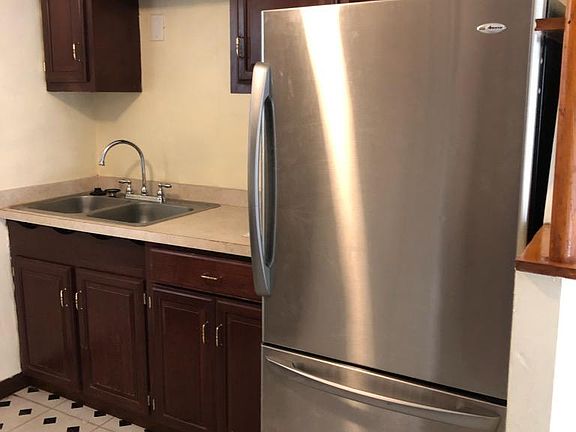 Newer regrigerator, and Cherry cabinets!