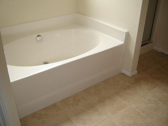 Master Bath w/ Garden Tub, Seperate Shower, and NEW Tile Flooring.