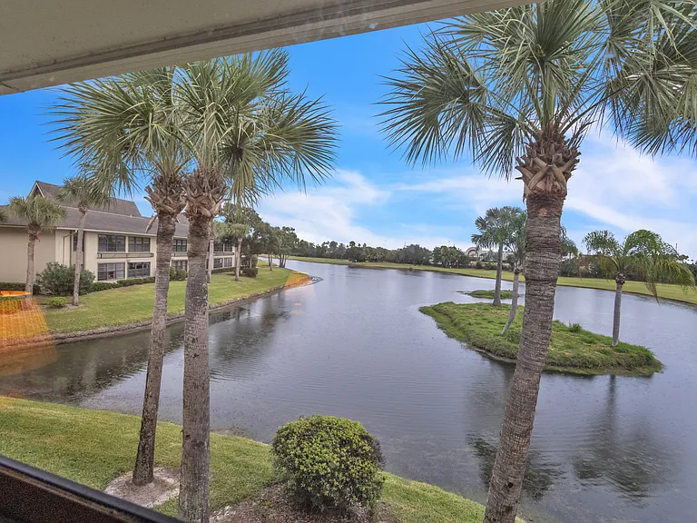Enjoy stunning lake & golf course views from the living room!