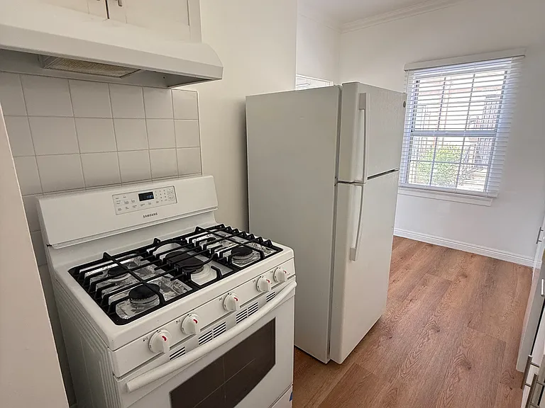 Full kitchen with stove and refrigerator and dishwasher