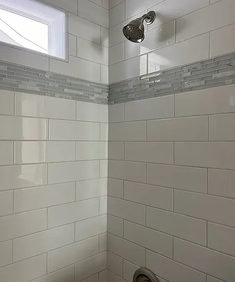 Tub/shower has window for natural light and ventilation