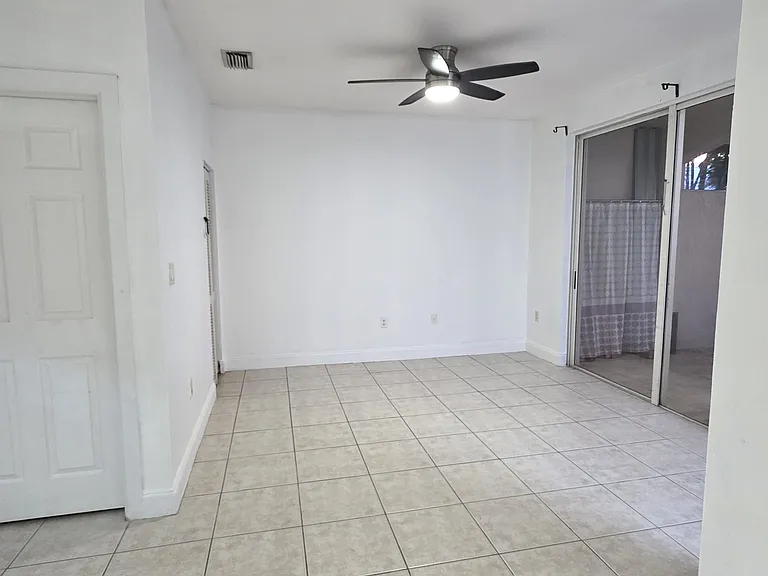 Family Room with seamless entry to screened backyard to entertain guests