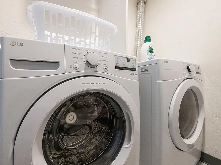 Full size LG front loading washer/dryer.