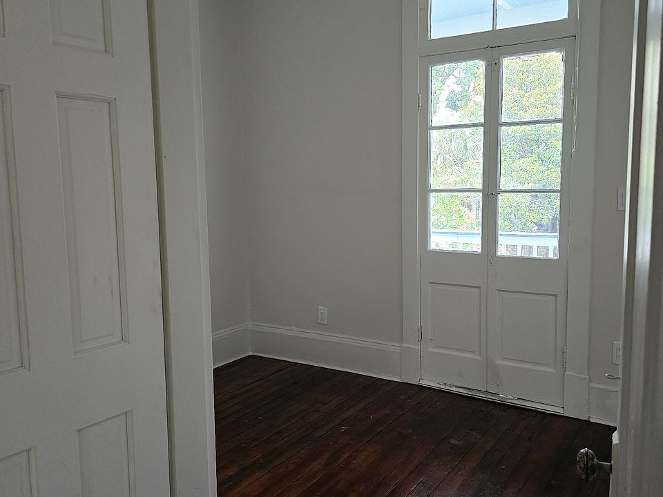 Cozy bedroom with complete access to full balcony.
