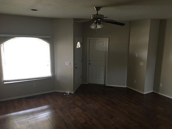 Photo of entry from front door - notice the hardwood floors and large window!