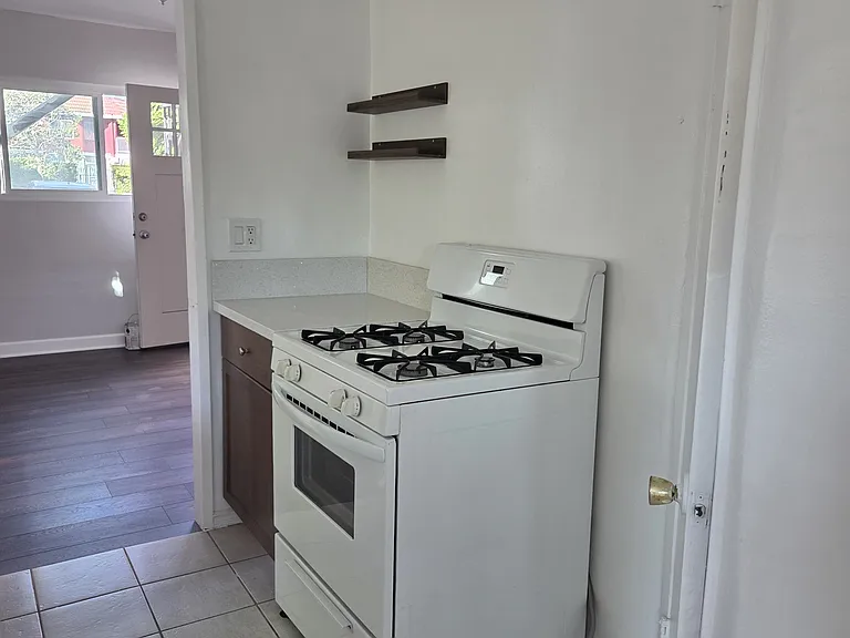 View of kitchen from bonus room. You can see dining room from this angle.