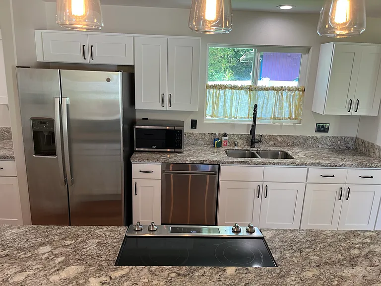 Newer stainless steel appliances, including a dishwasher