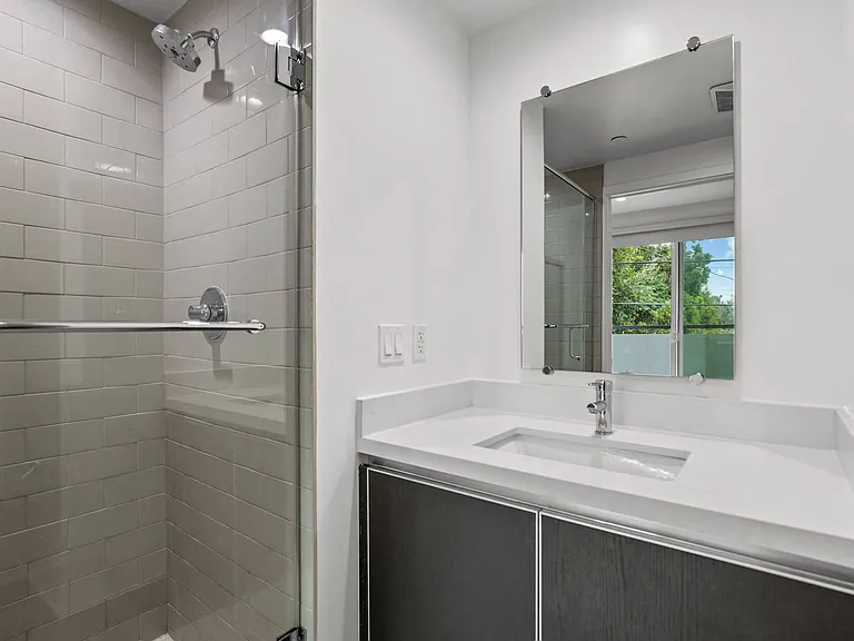 Bathroom with Stand-Up Shower and Vanity Cabinet Storage