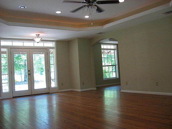 View of the Living room w/Trey Ceiling toward the front french doors.