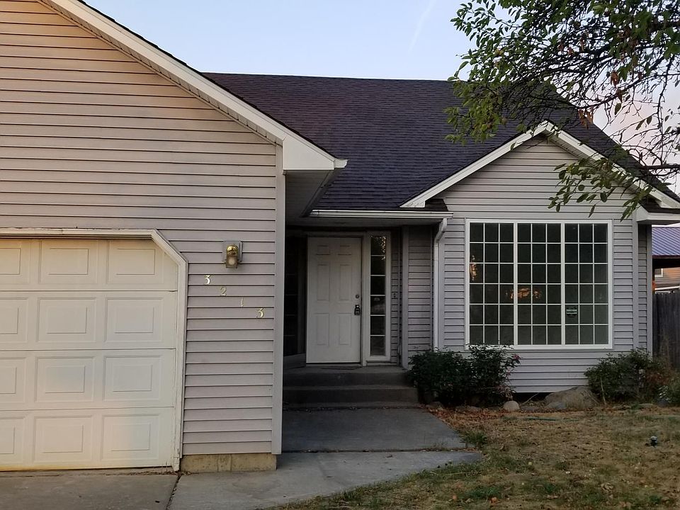 Two car garage with storage shelves, rv parking in back