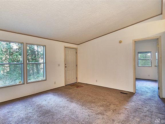Living room area with 2 big windows for viewing mother nature just out your door.