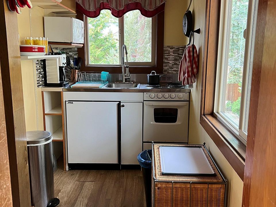 Full kitchen with oven, stove, refrigerator, and microwave