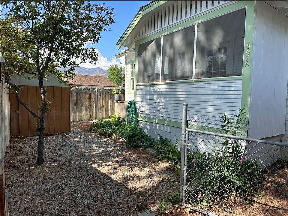 This is the fenced-in back yard with a shed. The part of the house is the screened-in porch.