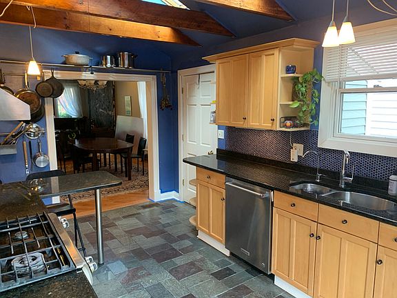 Kitchen view. Walk in storage/pantry.