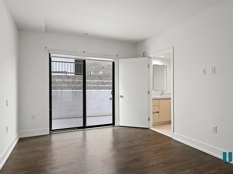 Bedroom with Vinyl Flooring, Bathroom, and Patio