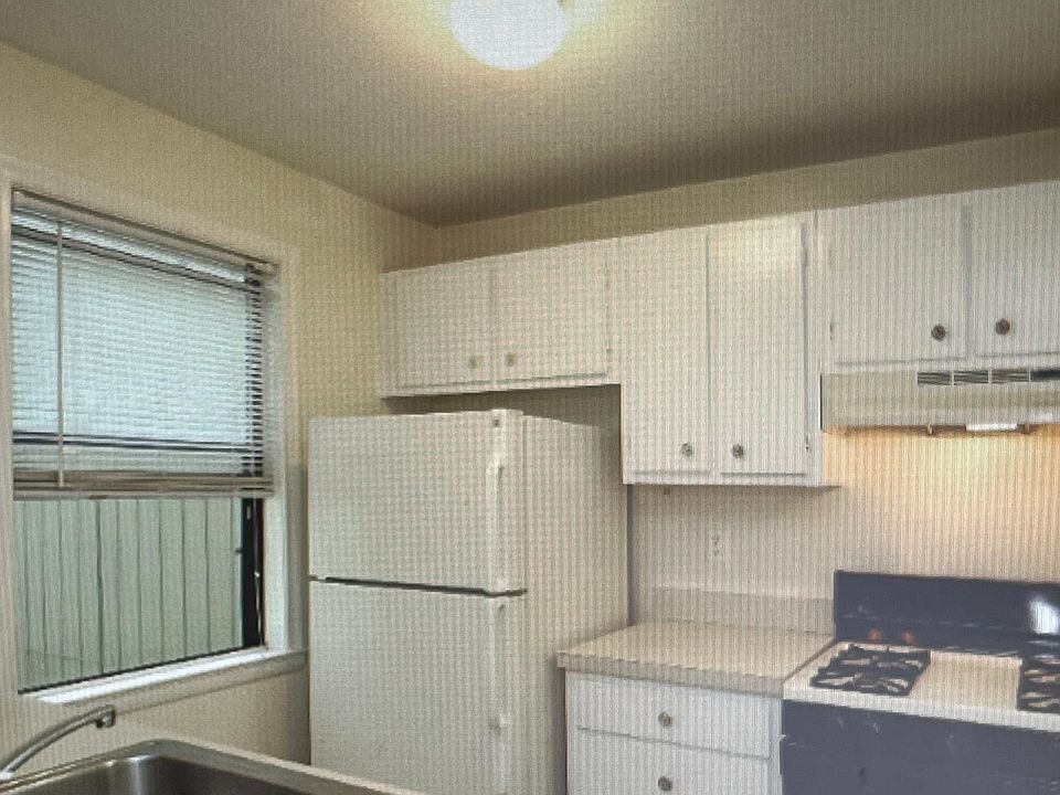 Galley type Kitchen with Stove, Refrigerator,Dispoal and Dishwasher