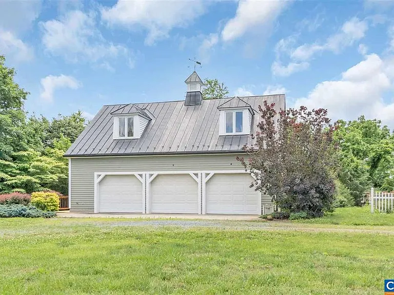 The detached garage is huge. It has 3 bays and is deep, with a workbench, plenty of storage, and even a bathroom. Upstairs is the optional artist loft. Round back is the potting shed and chicken coup.