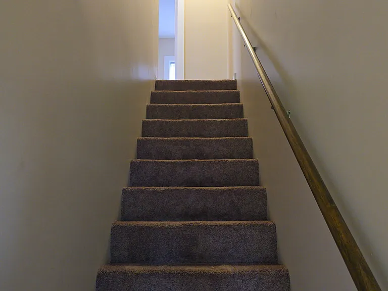 Stairs up to 2br/1ba