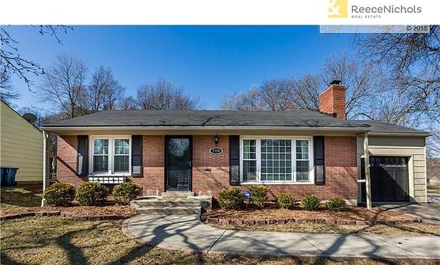 Pull into this darling Prairie Village home and park on the double wide driveway!