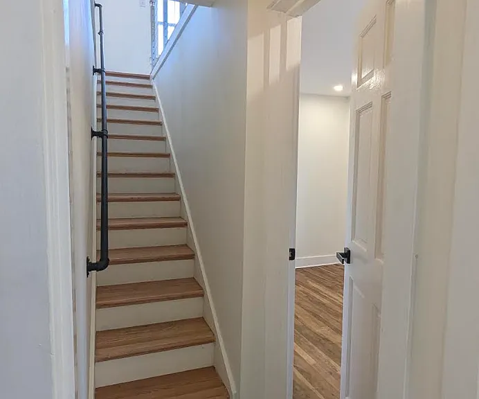Door to third bedroom and stairs to second floor