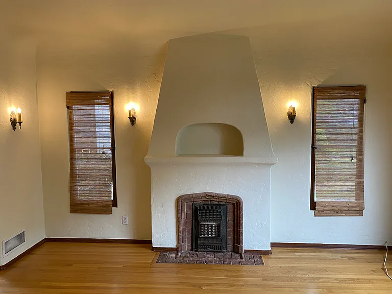 FAUX BATCHELDER TILE FIREPLACE AND ORIGINAL ANTIQUE SCONCE LIGHTING