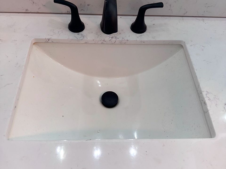 New cabinets and updated faucet features to match shower.