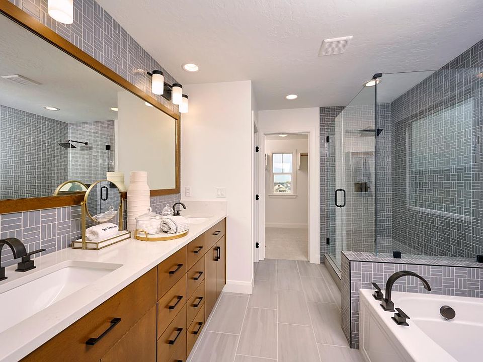 Representative Photo - Spacious primary bath with dual-sink vanity and distinctive finishes