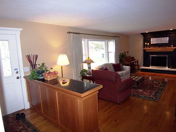 Spectacular Living Room w/hardwood floors and dramatic stone fireplace