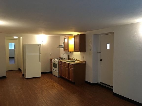 Kitchen with view of front door and closet area