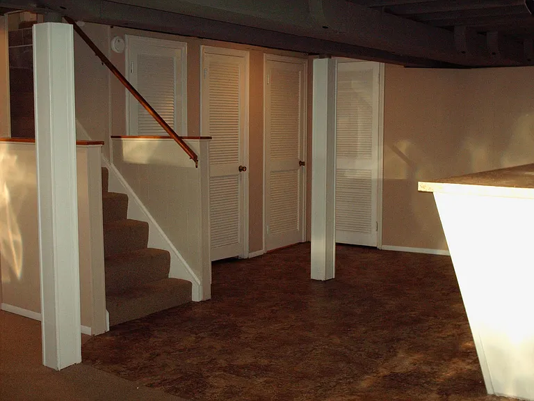 Basement area at bottom of stairway.